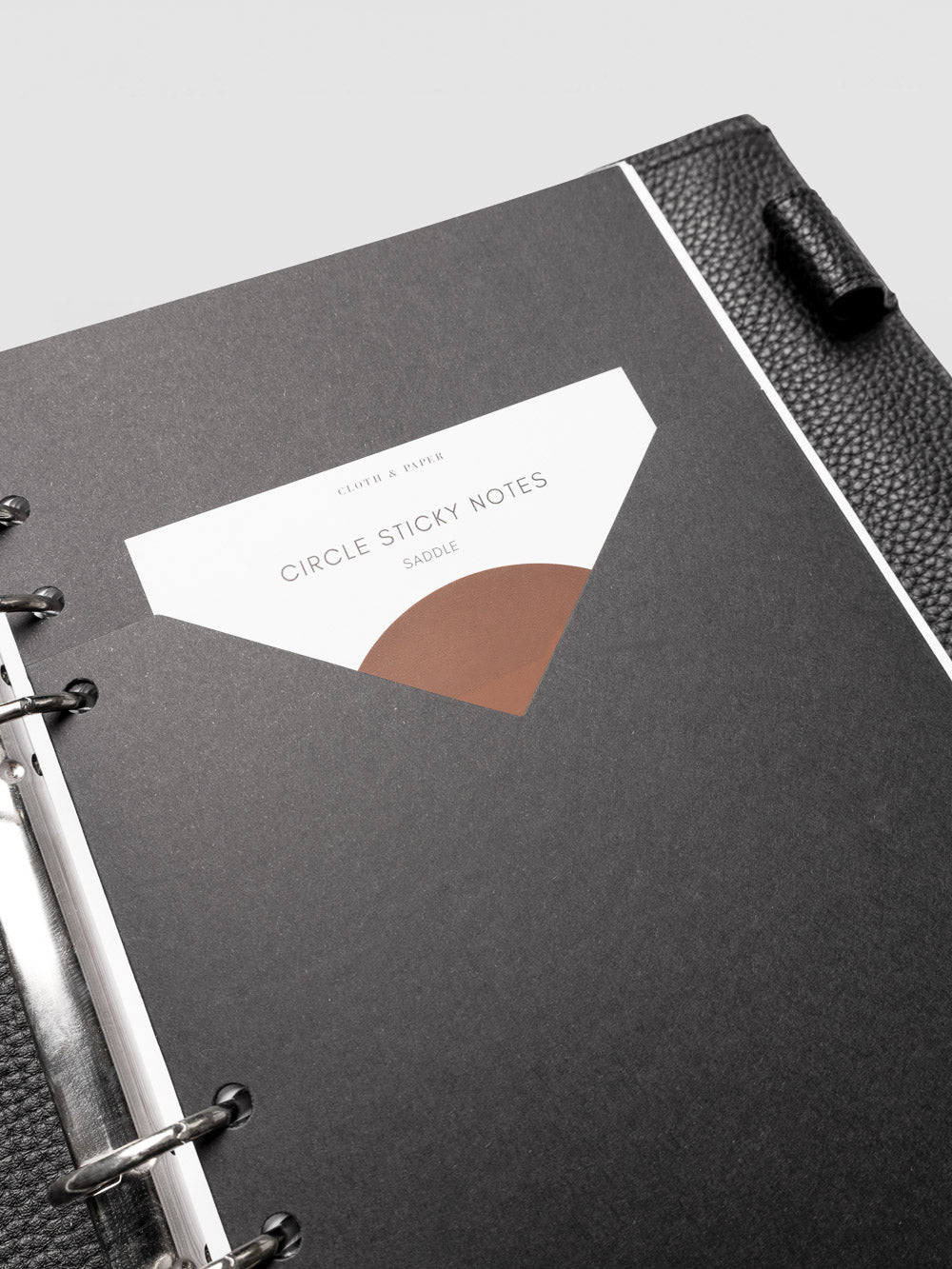 Detail view of the black planner paper pocket folder shown in size A5 6-Ring Punch