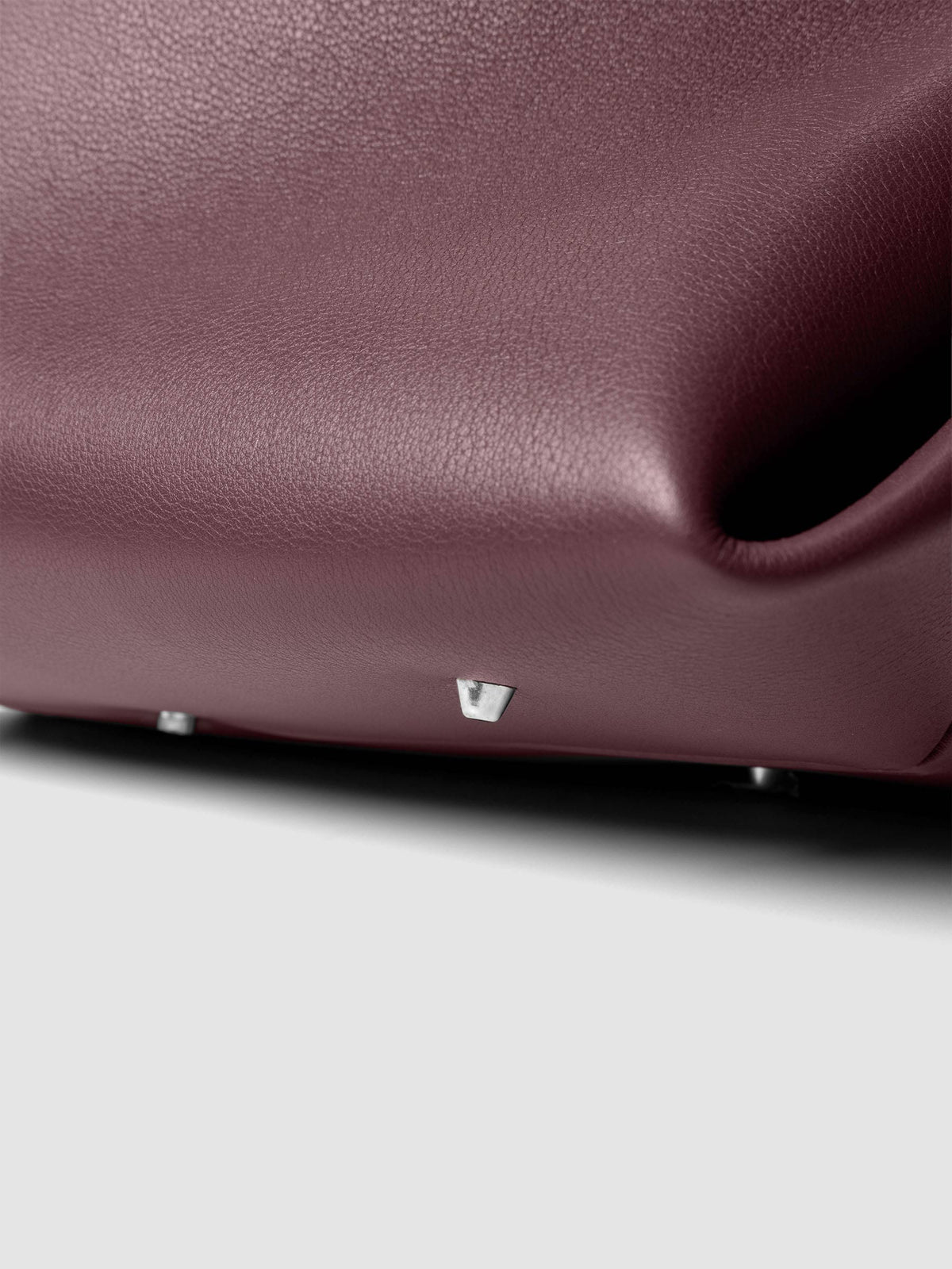 Detail view of a the bottom of The Metro Tote in the color Madrid.