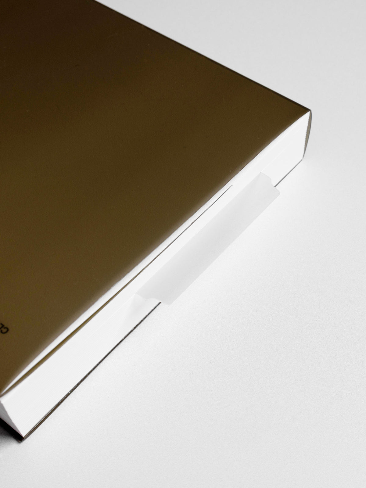 Page marker in use in a perfect bound notebook.