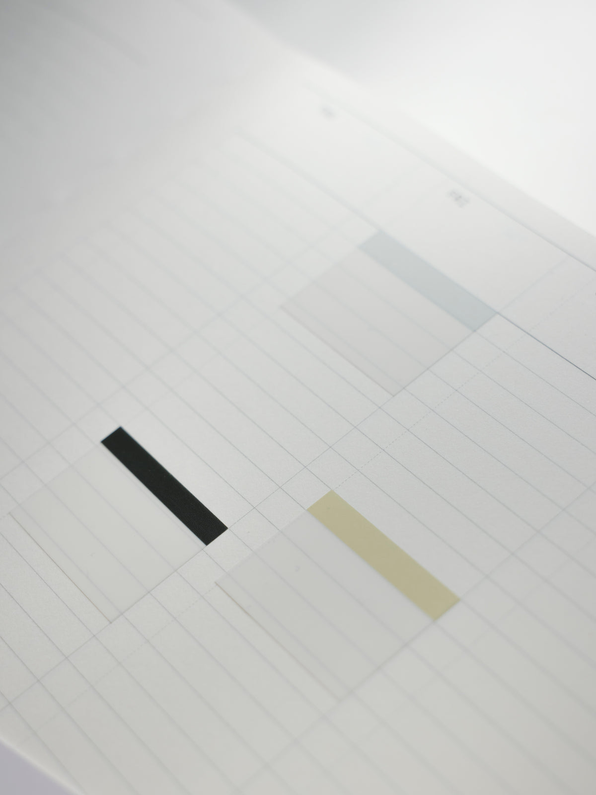 Light blue, light green, and charcoal index page flags applied to a planner page