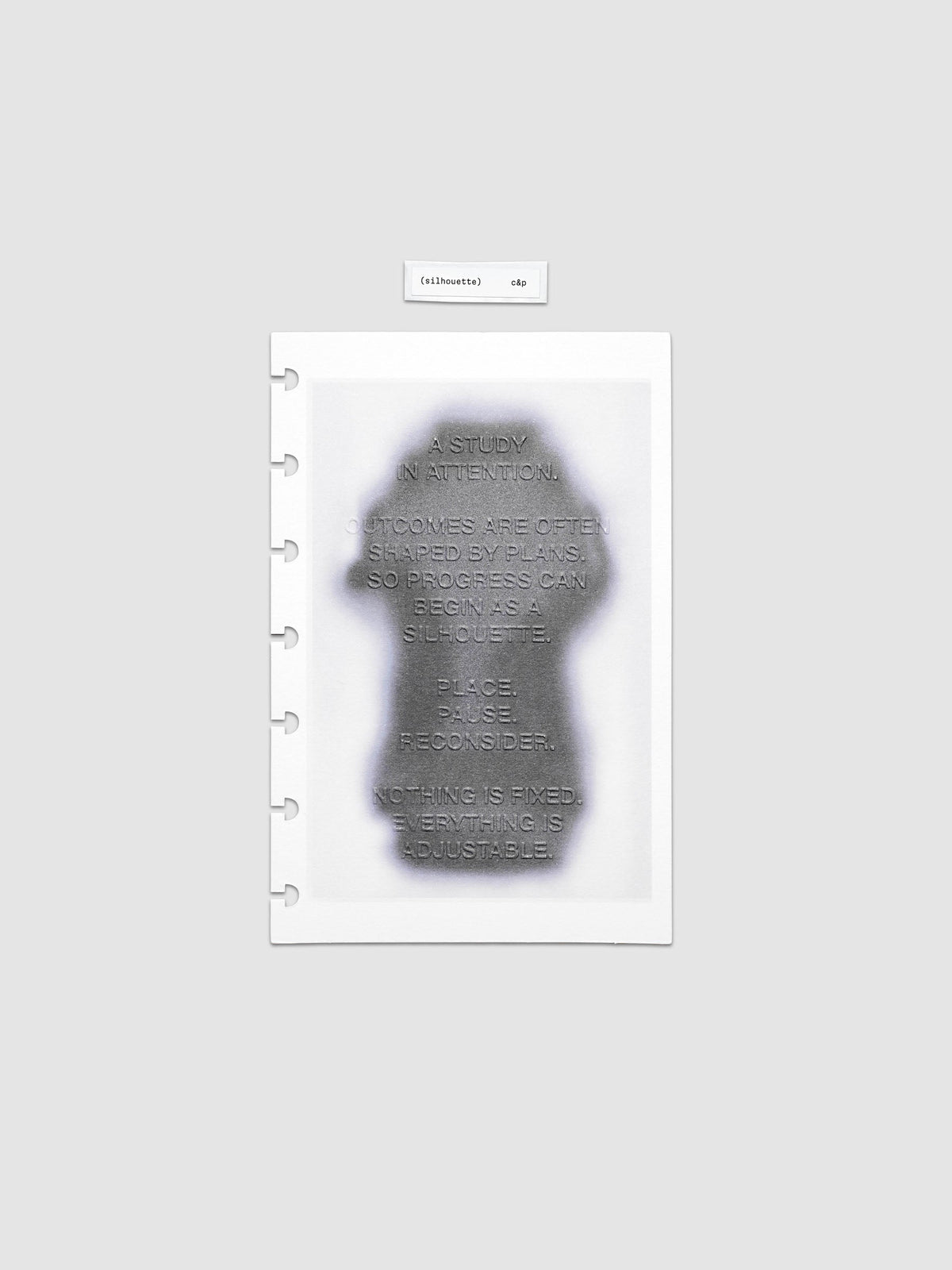 Silhouette Planner Dashboard in HP Mini. Greyscale silhouette print with embossed text on paper. Image 1 of 1.