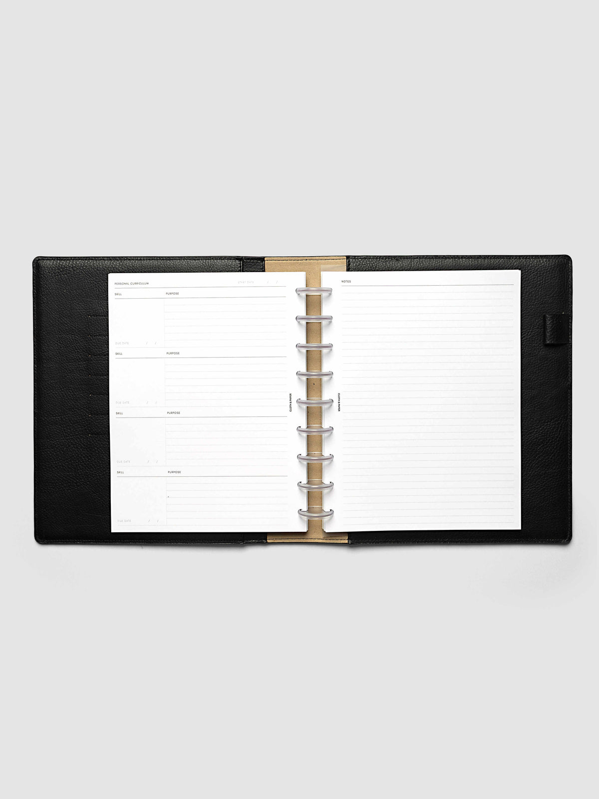 The HP Classic 9-Disc Punch Personal Curriculum Planner Inserts open in a black leather ring bound planner to the index spread, four skill entries with purpose and due date on the left and a lined notes page on the right