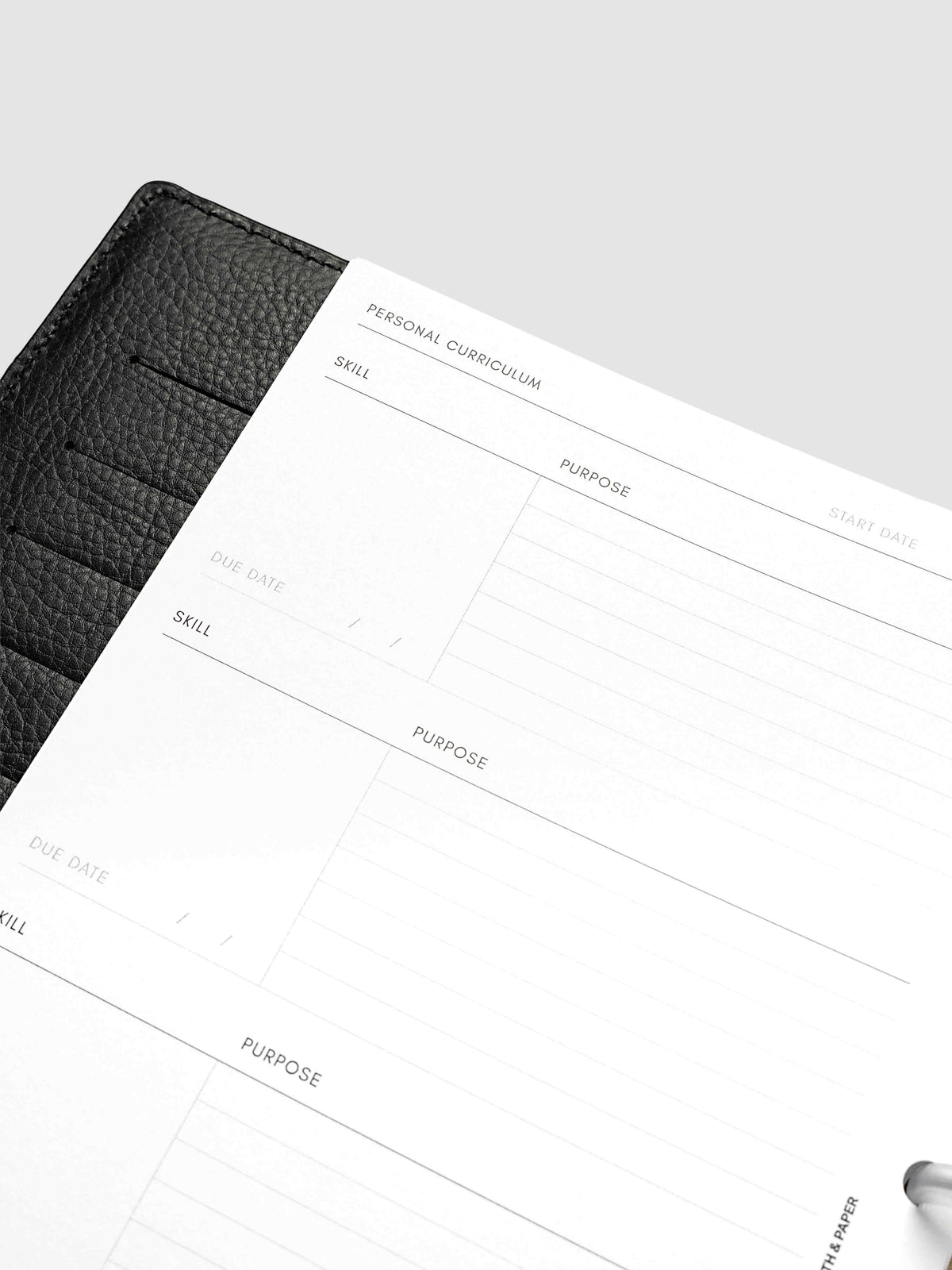 Close-up at an angle of the index page of the Half Letter 8-Disc Punch Personal Curriculum Planner Inserts, showing the repeating skill, purpose and due date entries under a start date