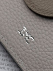 Close up example of silver foil debossing with the initials IMC.