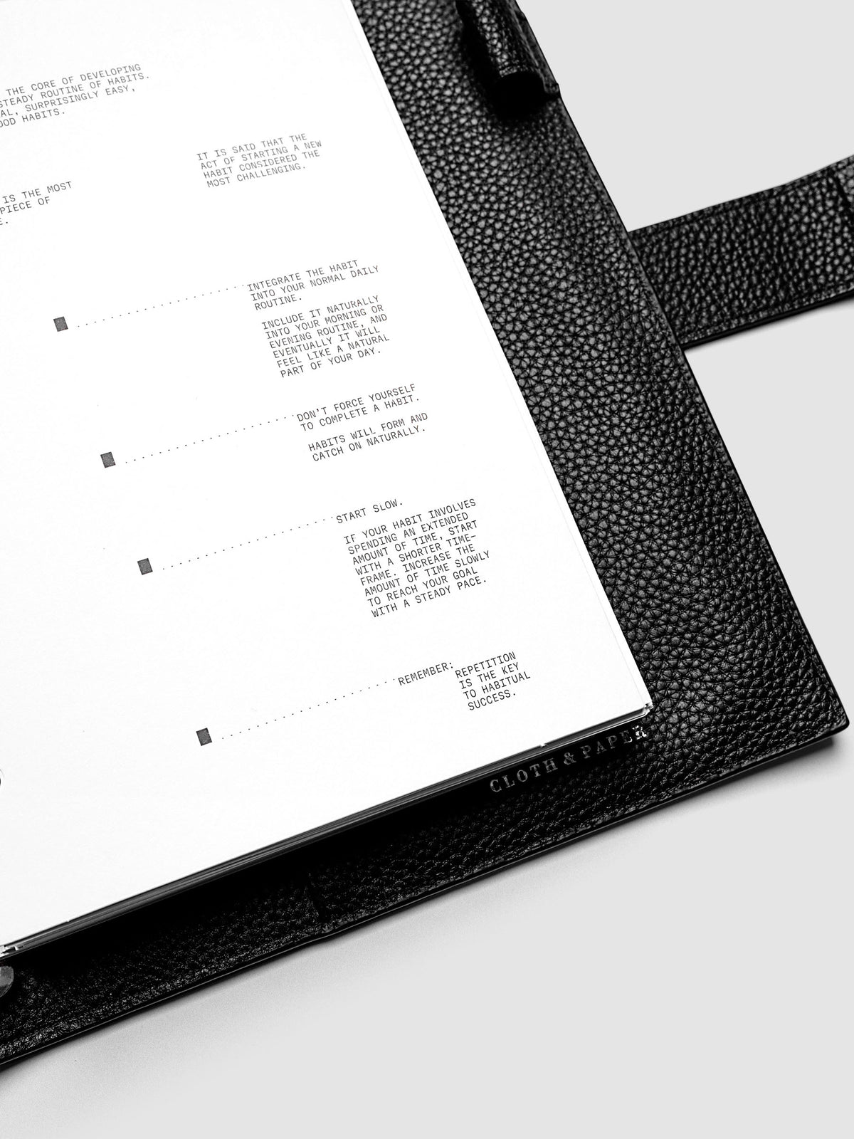 Close up view of a white paper dashboard with black printed text design.