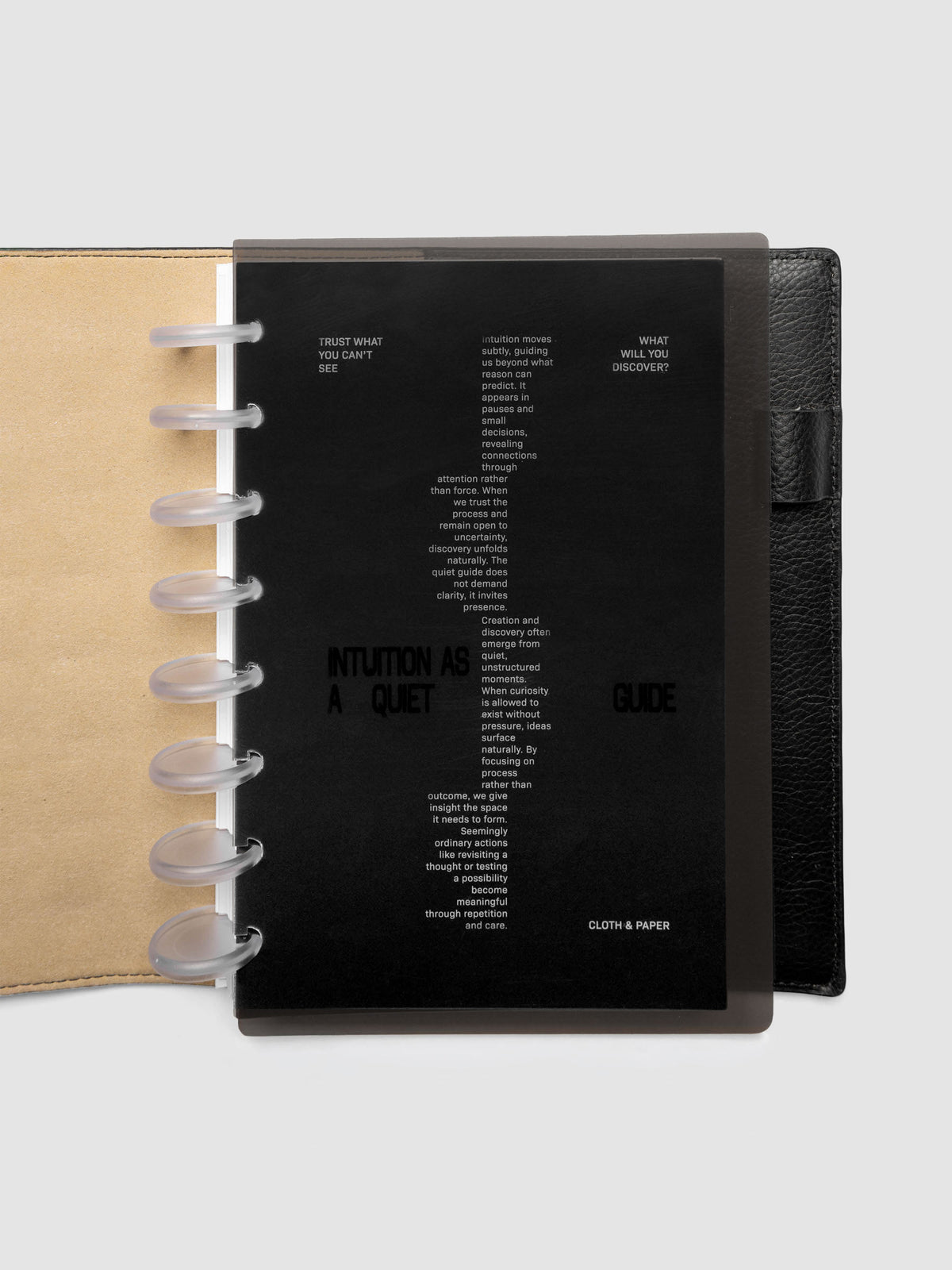 Black Intuition Ultra Thin Planner Cover + Dashboard Set in size Half Letter 8-Disc shown inside a planner