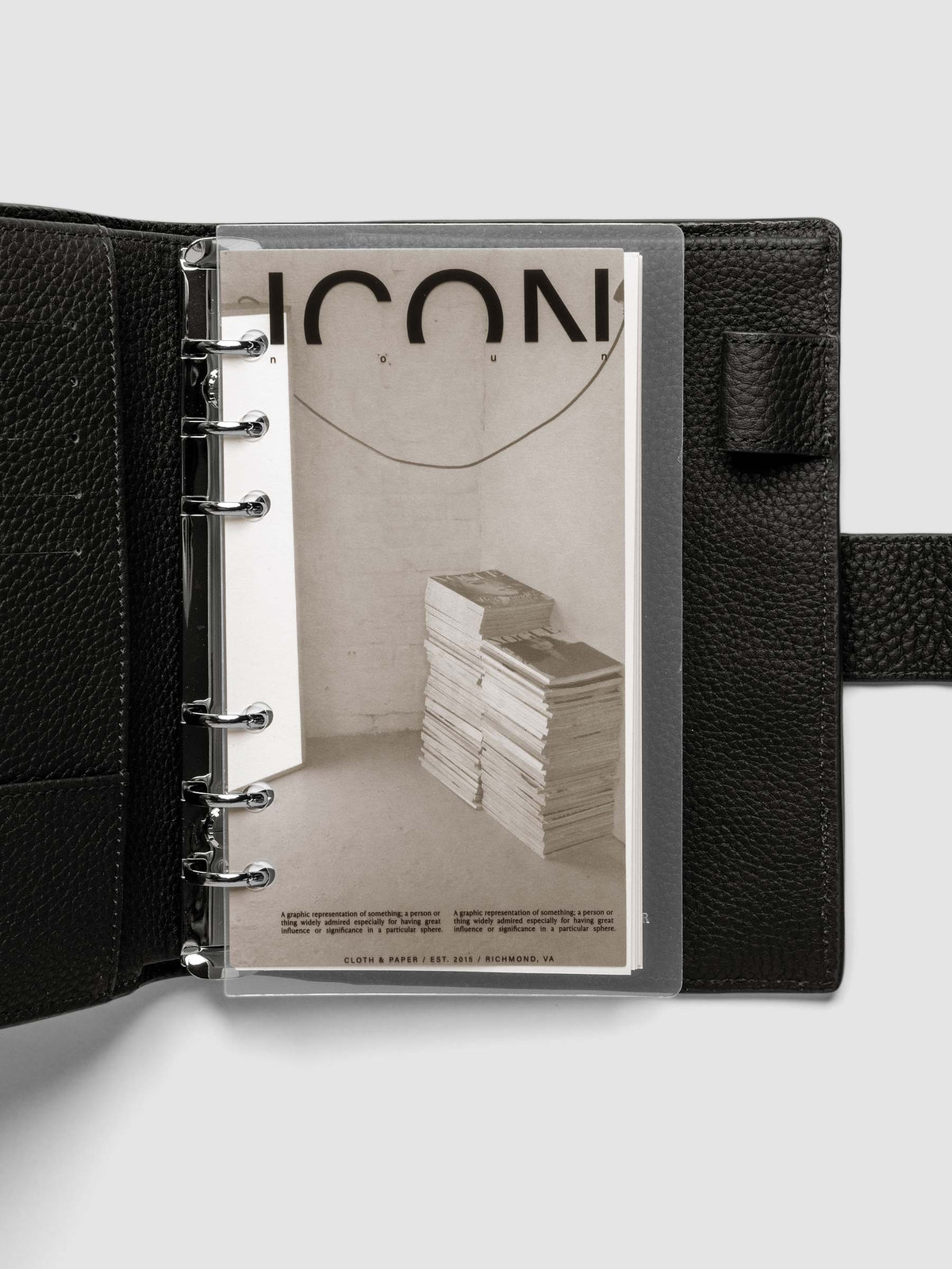 Clear planner cover with black text and a photographic dashboard shown pre-punched for 6-ring planners in size Personal in a black agenda.