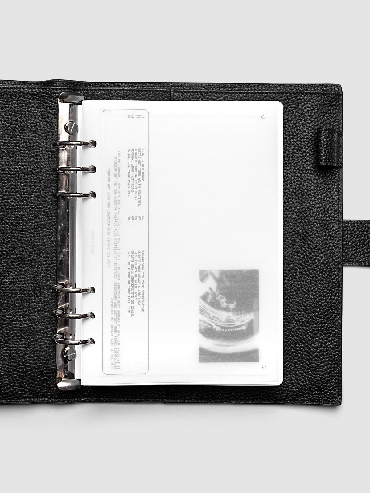 Side A & Side B Planner Dashboard in size A5 shown in a black agenda.