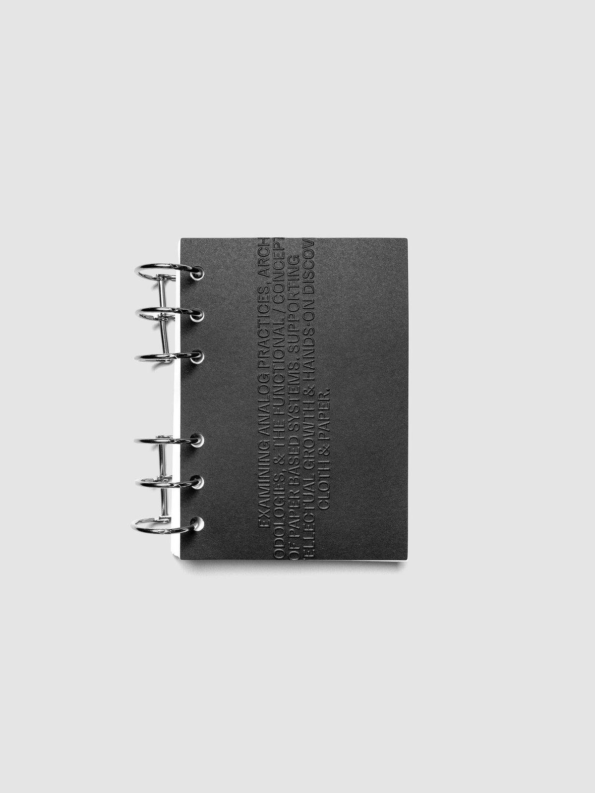 Black embossed Analog Embossed Planner Dashboard without drop card shown in size A6.