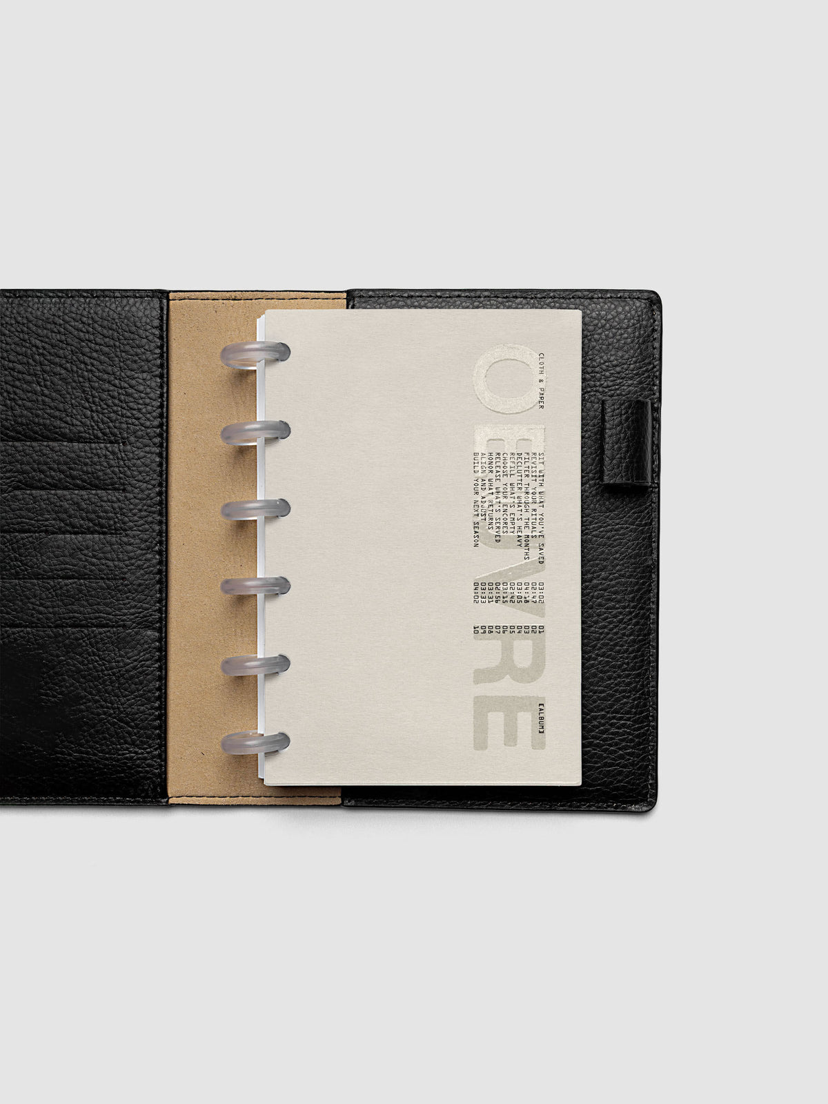 Oeuvre Planner Dashboard in CP Petite 6-Disc Punch size shown in a planner
