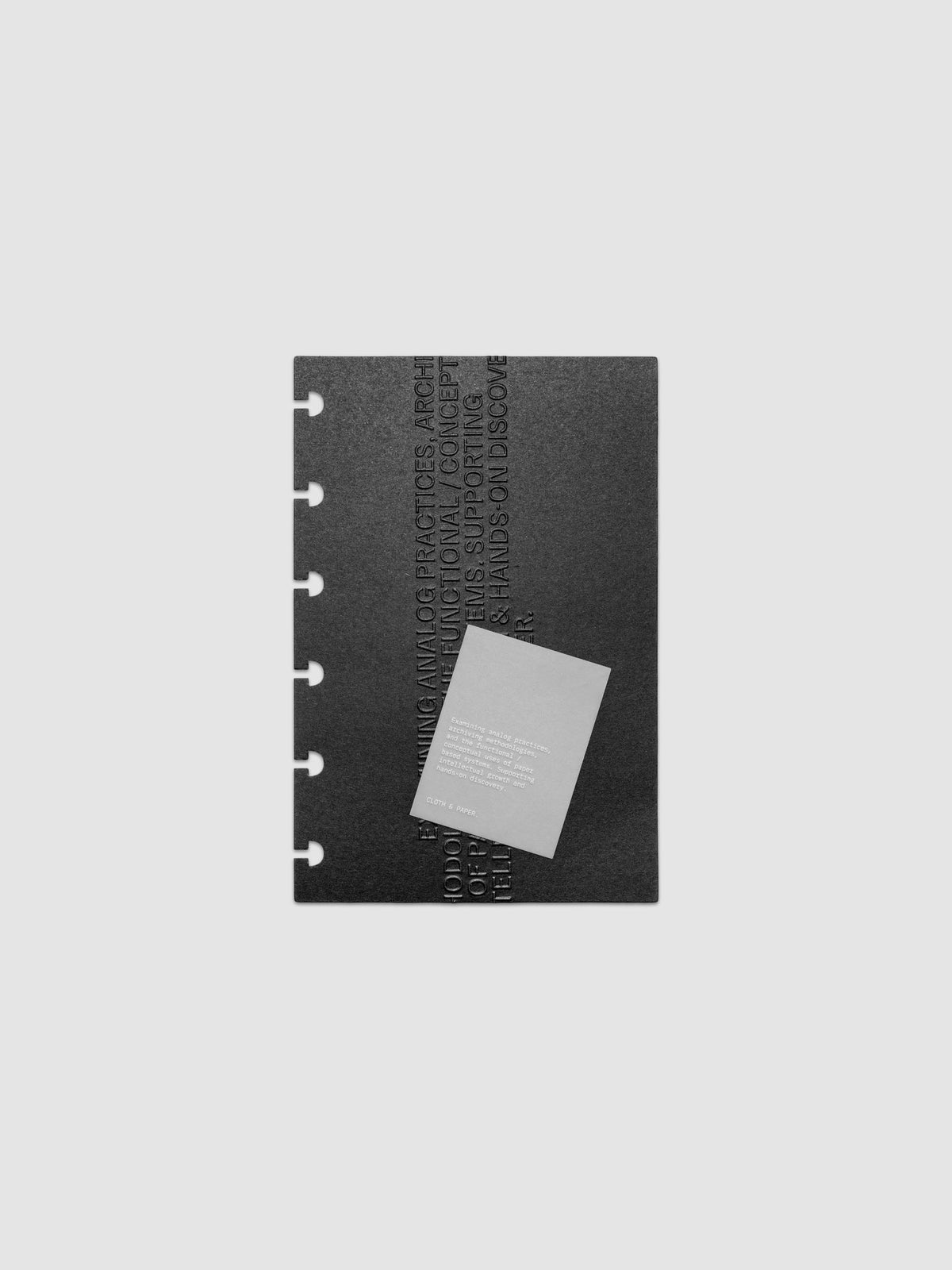 Black embossed Analog Embossed Planner Dashboard with drop card shown in size CP Petite.