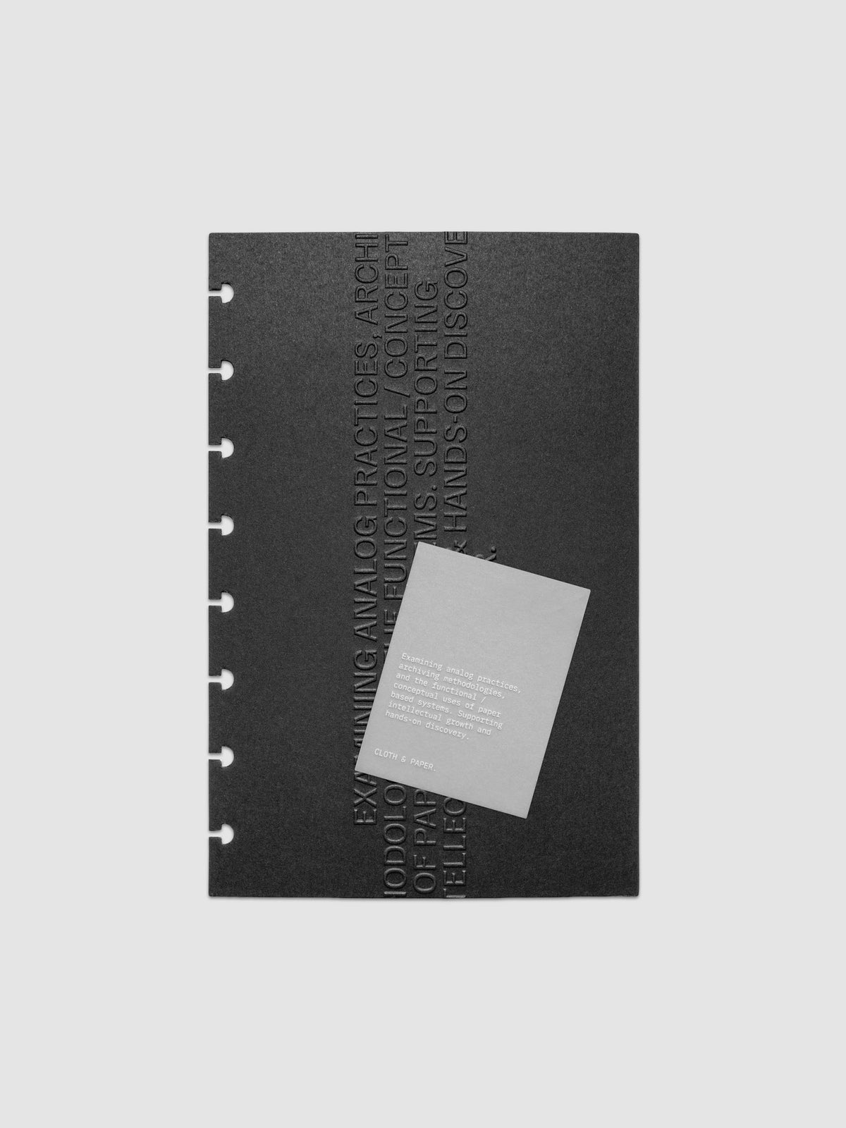 Black embossed Analog Embossed Planner Dashboard with drop card shown in size Half Letter 8-Disc Punch.