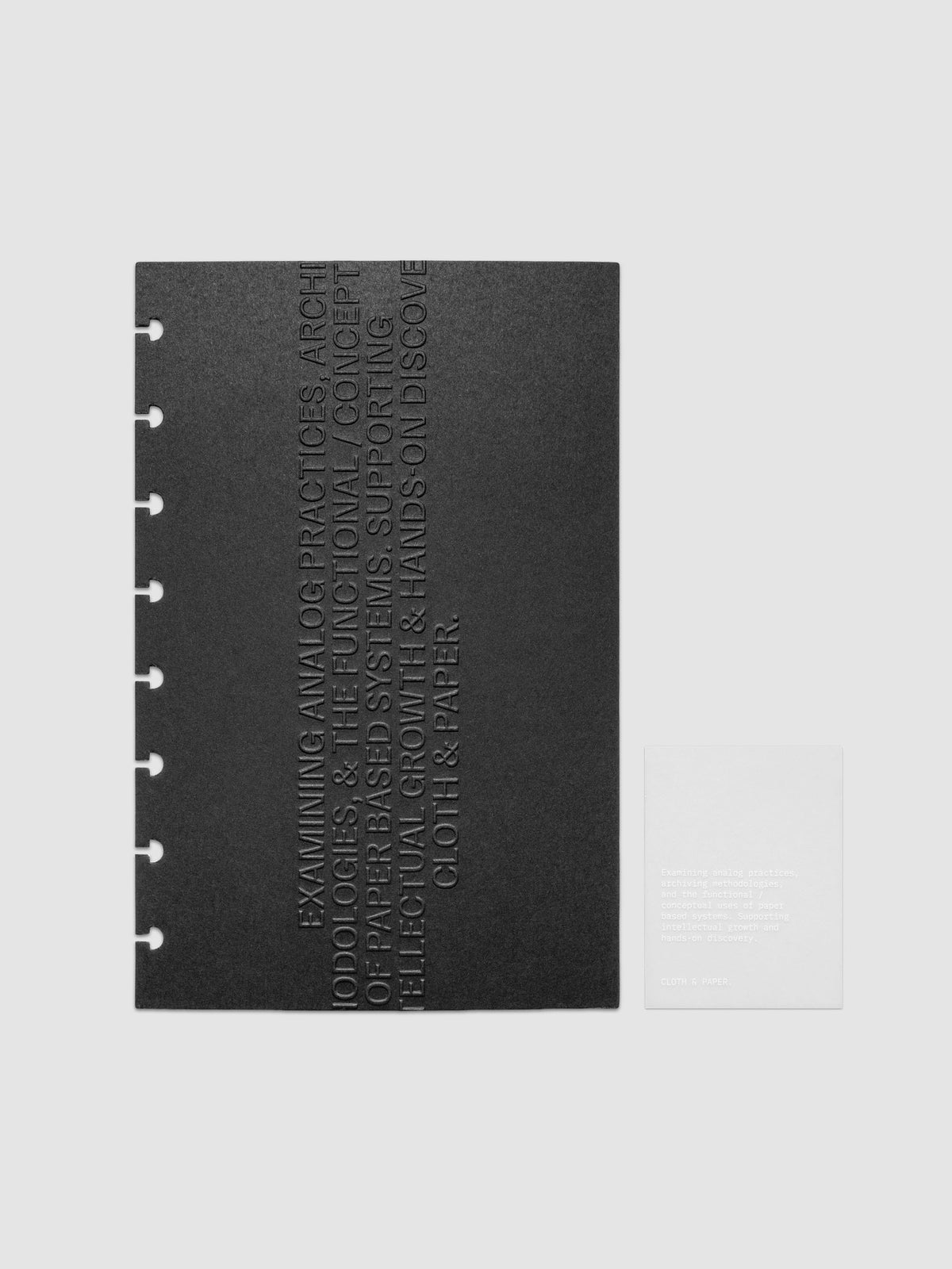 Black embossed Analog Embossed Planner Dashboard with drop card shown in size Half Letter 8-Disc Punch.