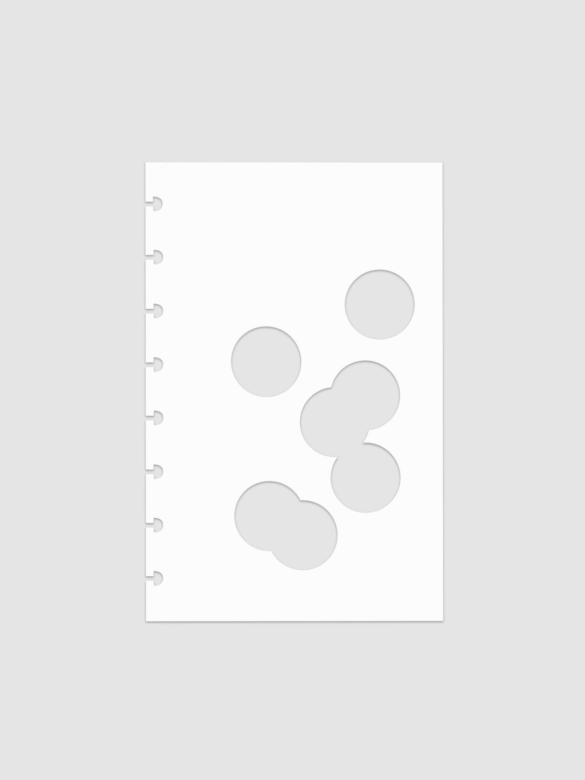 White dashboard from the Ink Blot Planner Dashboard Duo on a neutral background in size Half Letter, pre-punched for discbound planners.