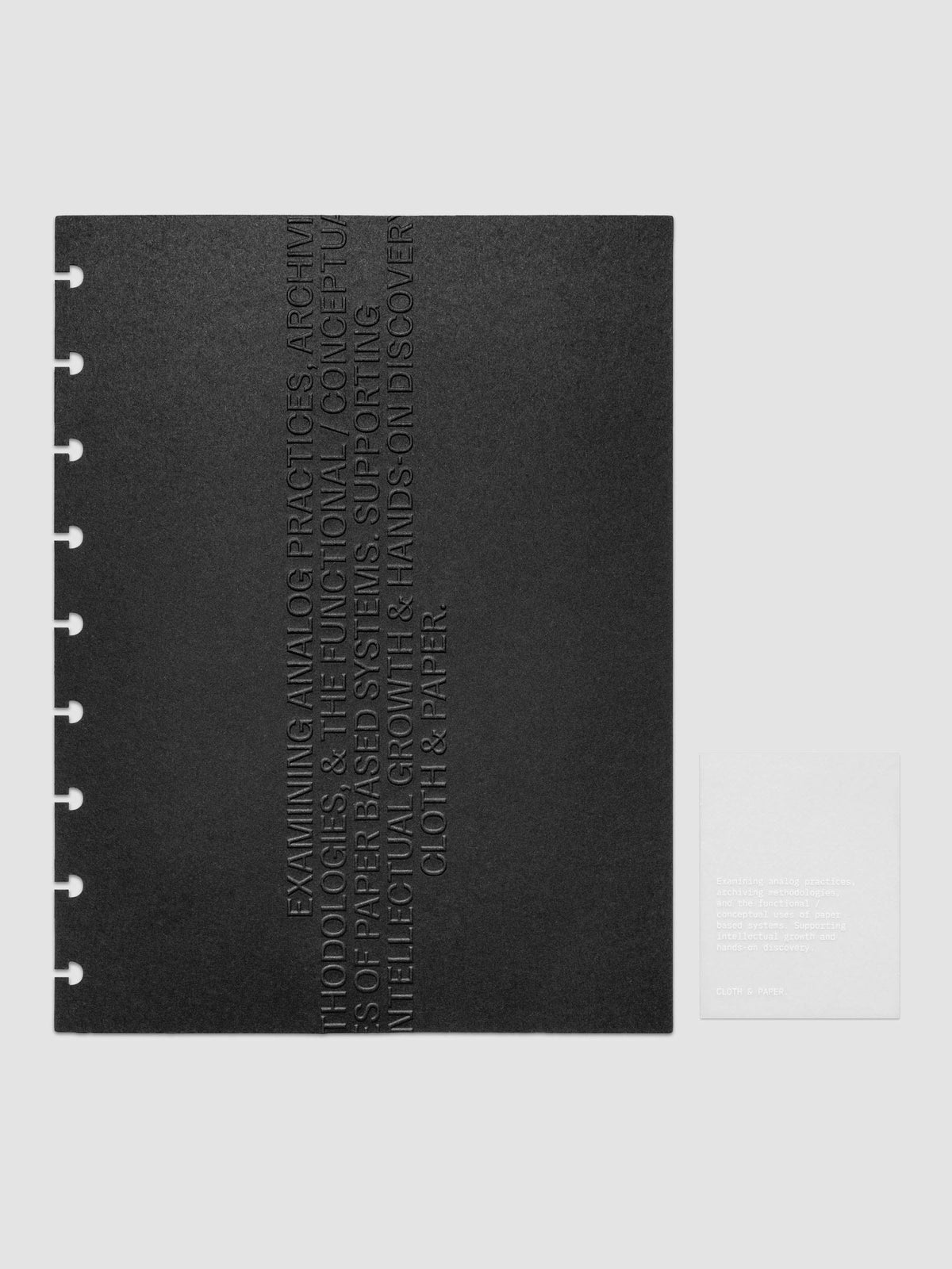 Black embossed Analog Embossed Planner Dashboard with drop card shown in size HP Classic 9-Disc Punch.