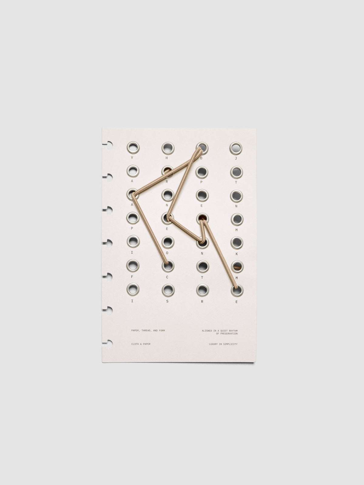 Cadence Dashboard with grommets and string on beige cardstock shown in size HP Mini for discbound planners and notebooks.