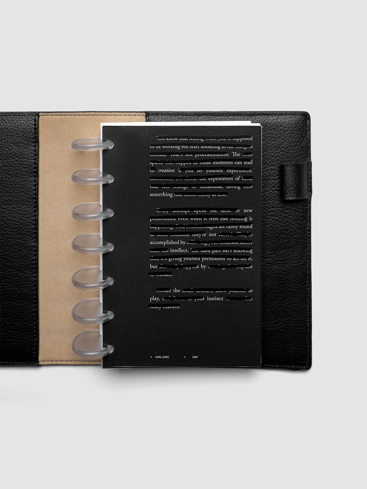 Black, white, and transparent dual layer planner dashboard shown in size HP Mini 7-Disc Punch inside a planner