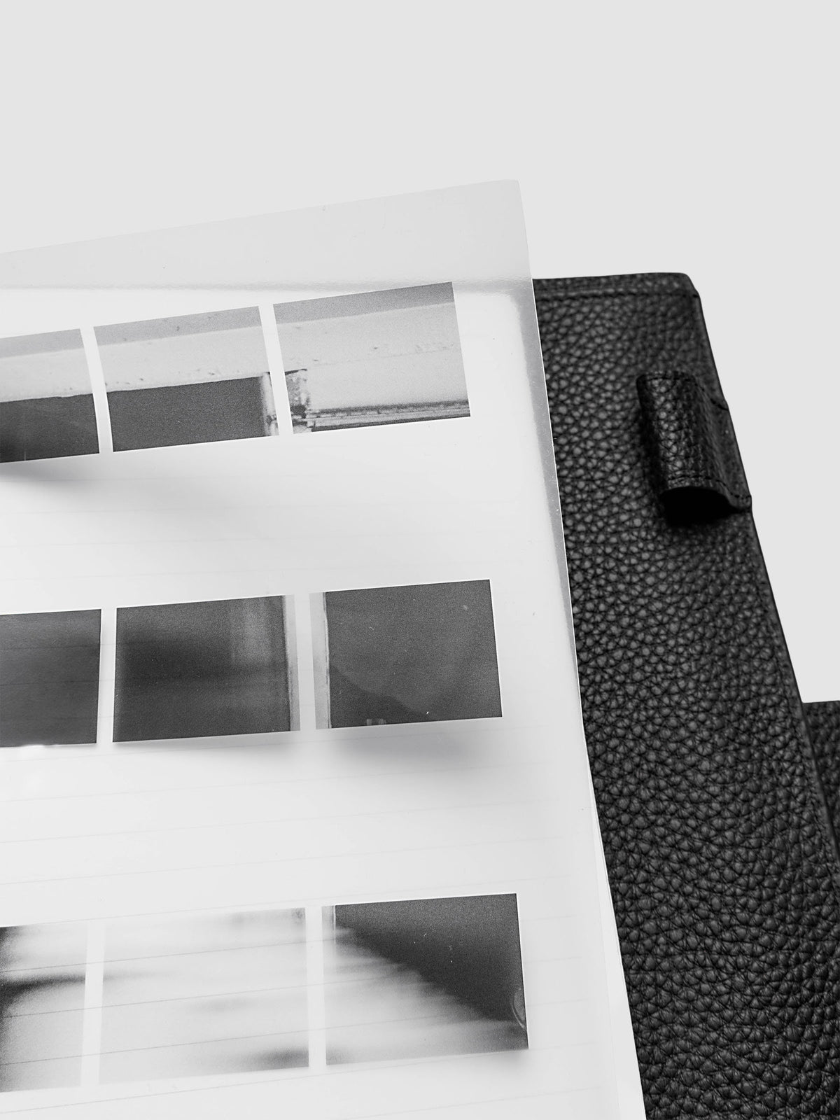 Film Strip Planner Dashboard Duo A5 6-Ring Punch top right close-up of film strip plastic bottom dashboard lifted inside a planner