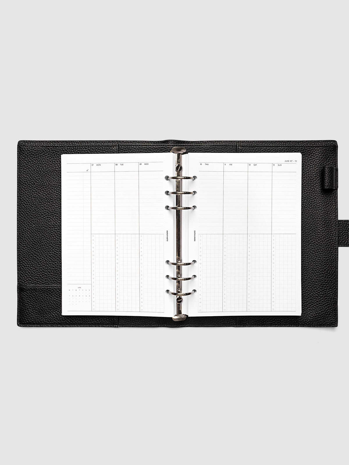 A5 6-Ring Punch weekly time block spread showing left and right pages in a planner