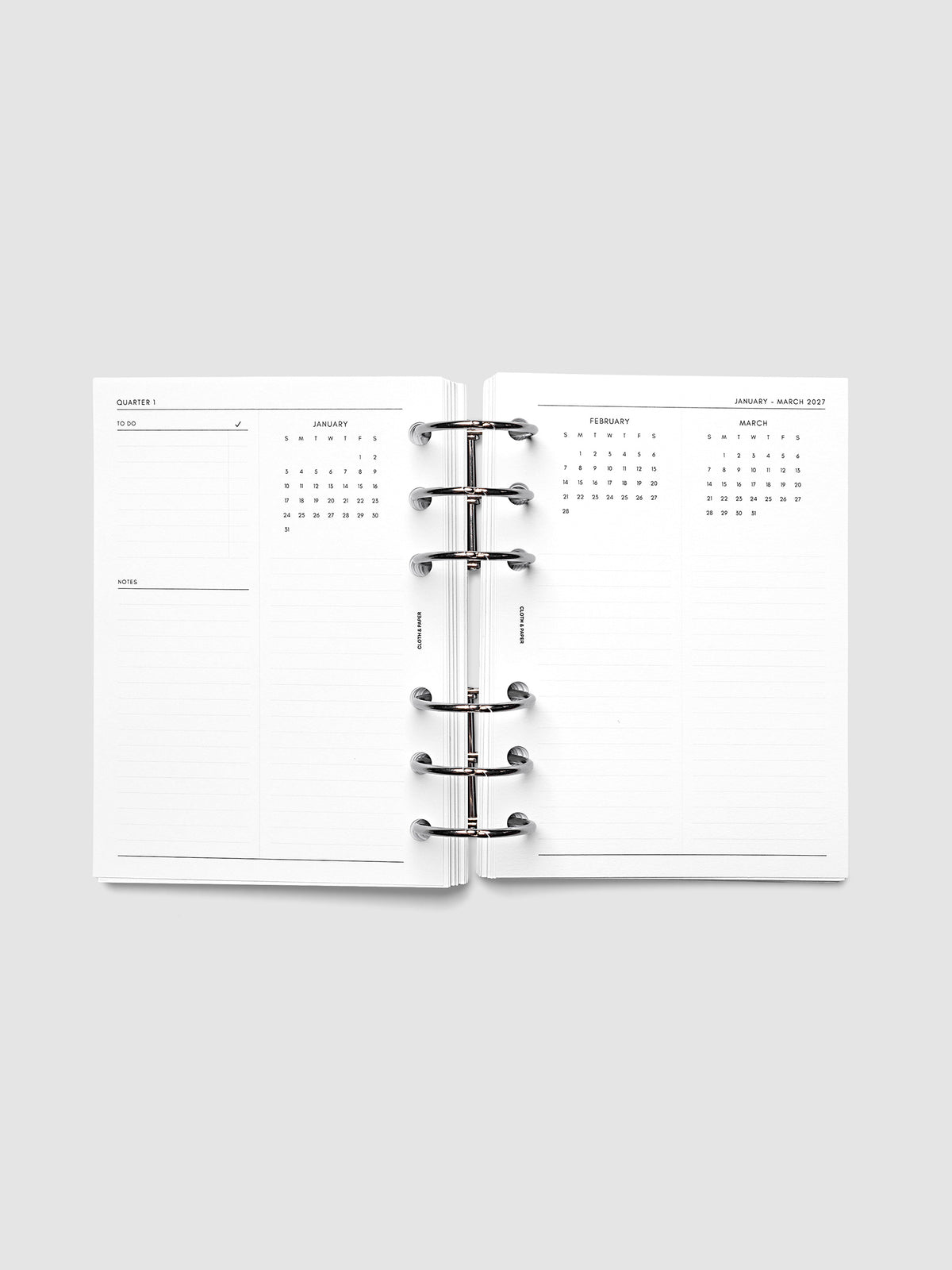 2027 Dated Yearly Overview Planner Inserts Sunday Start, A6 6-Ring Punch, full quarterly spread showing goal-setting, to-do, and notes sections on the left page alongside three monthly calendar views with notes sections on the right page, shown inside a planner