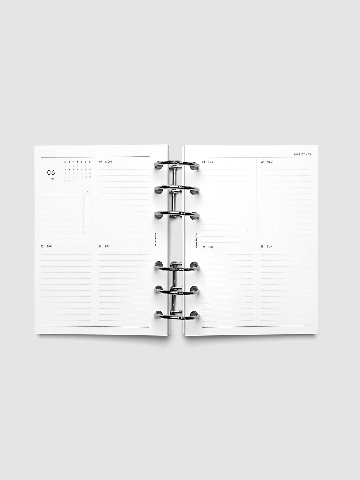 Both pages inside planner: 2027 Dated Weekly Vertical Planner Inserts, Monday Start, A6 6-Ring Punch, full week-on-two-pages spread showing a two-column two-row daily grid with lined sections, mini monthly calendar and task list in the top left, shown inside a planner
