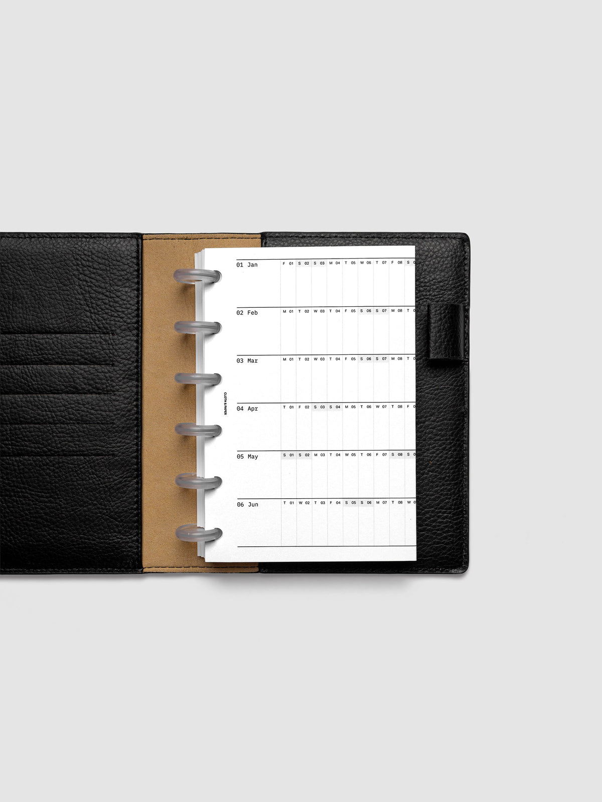 2027 Dated Fold Out Insert tucked into a CP Petite 6-Disc Punch discbound planner, shown closed.