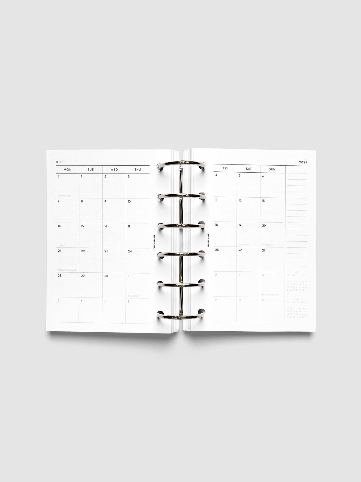 2027 Dated Monthly Planner Inserts, Monday Start, Pocket 6-Ring Punch, full two-page monthly calendar spread with Monday start, notes column, and mini calendars in the bottom right corner shown inside a planner