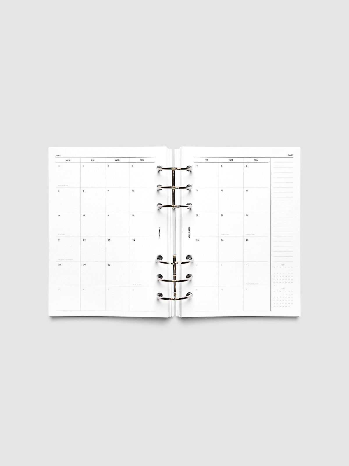 2027 Dated Monthly Planner Inserts, Monday Start, Personal Wide 6-Ring Punch, full two-page monthly calendar spread with Monday start, notes column, and mini calendars in the bottom right corner shown inside a planner