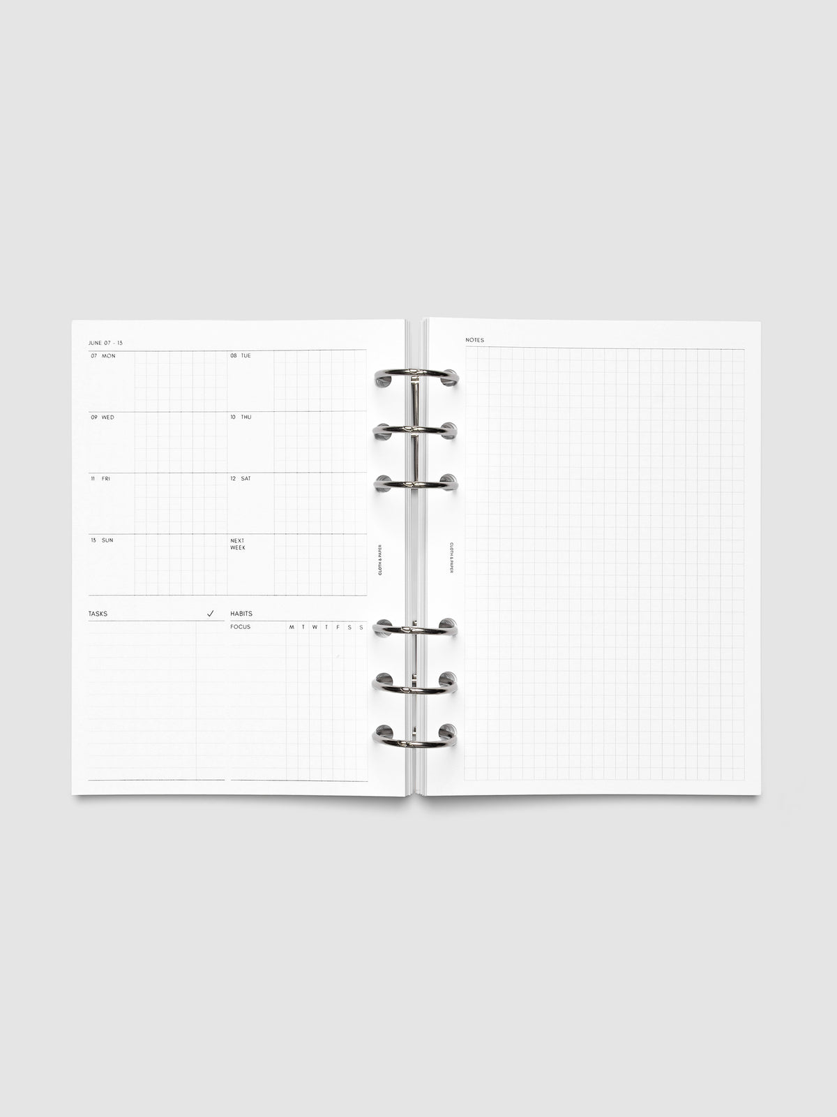 Open planner showing the full two-page 2027 Dated Weekly Admin spread in Personal Wide 6-Ring Punch size, with the weekly overview and task and habit tracking sections on the left and a graph notes layout on the right