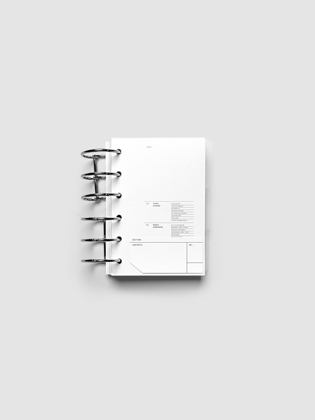 Clear side tab dividers sized for Pocket planners shown in use with a blank label with headers section, content, and no.