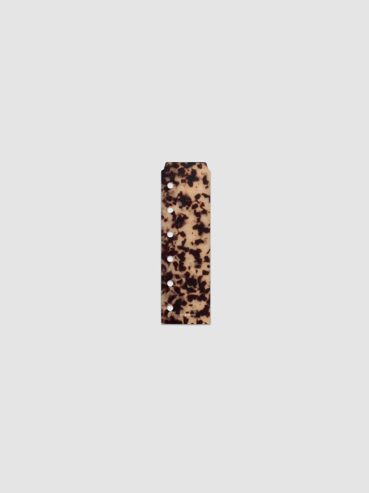 One narrow page marker in tortoiseshell pattern, shown in size Pocket.