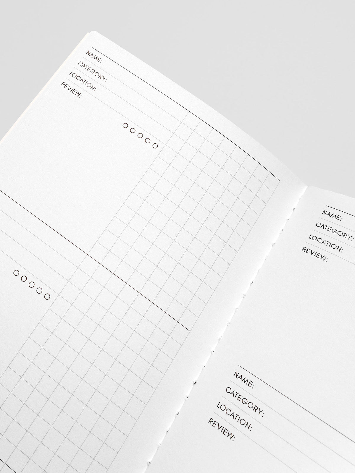 Travel Notebook A5 Slim Experience Tracker close up angled view of interior fields and review rating circles