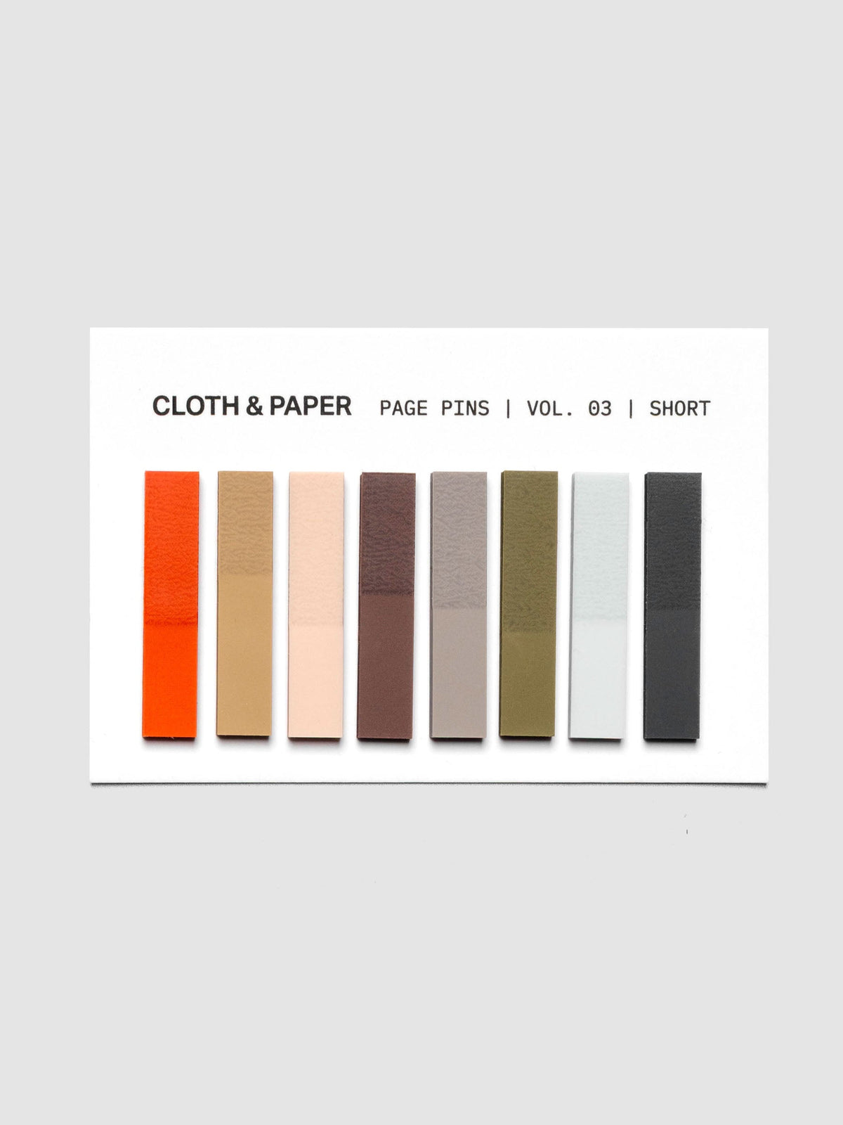 Page Pins Short on backing card, eight colorways: deep orange, warm light brown, peach, burgundy, grey, olive, light blue, and navy