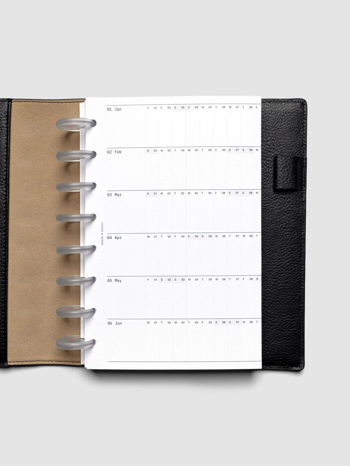 2026 Yearly Fold Out Planner Insert in size Half Letter shown folded in a black leather folio cover.