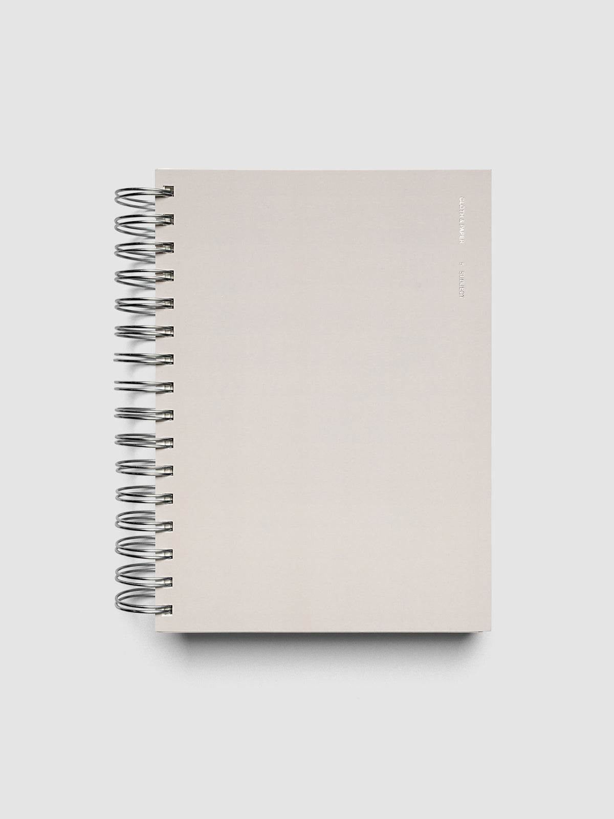 5 Subject Notebook A5 Punch front cover angled view showing silver wire spiral binding