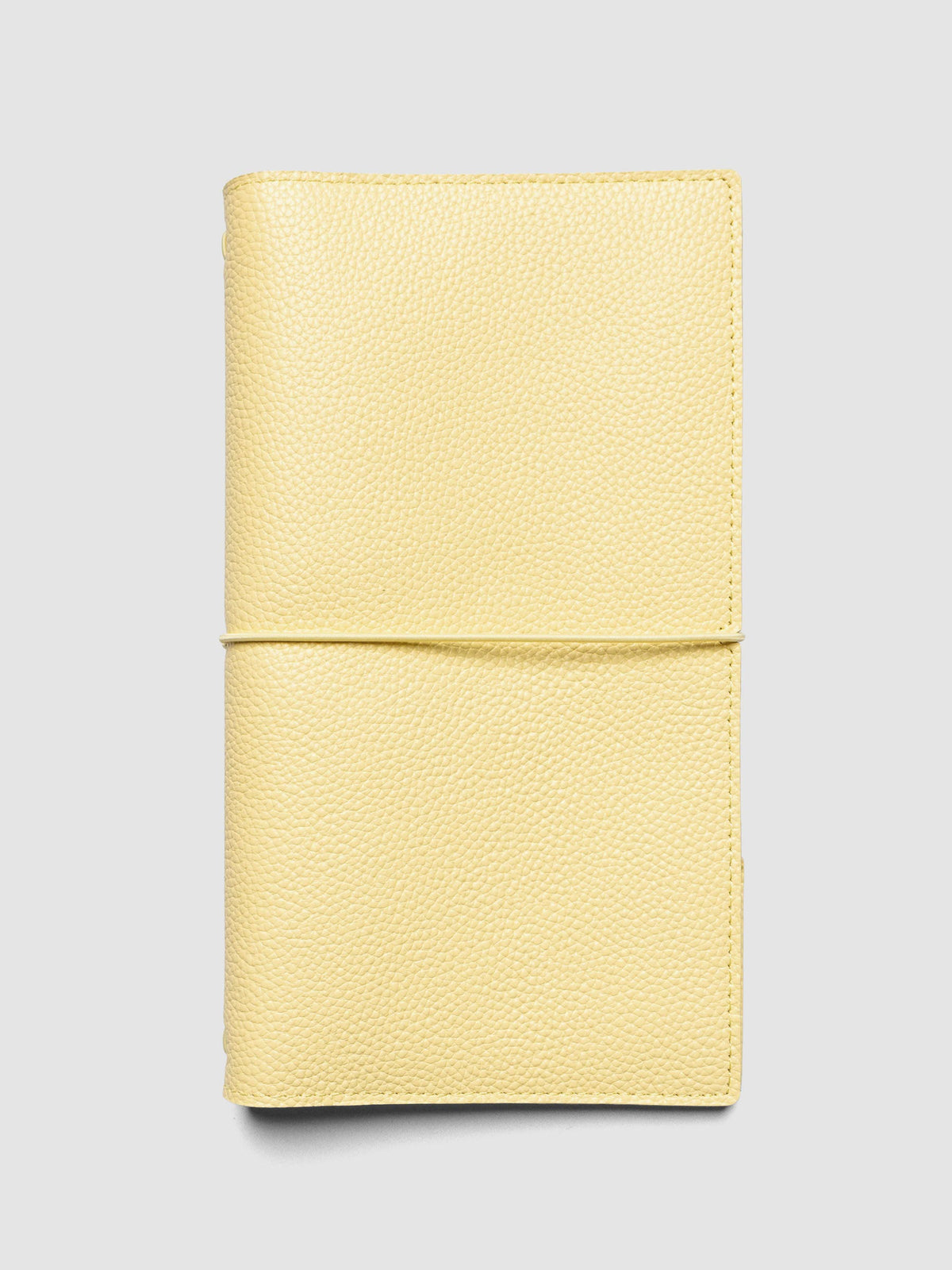 Butter yellow genuine leather travel notebook cover shown in size A5 Slim.