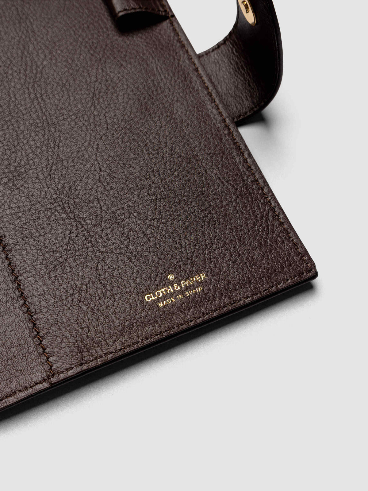 Detail of three credit card slots on the interior of a dark brown genuine leather Personal Wide 6-ring planner cover