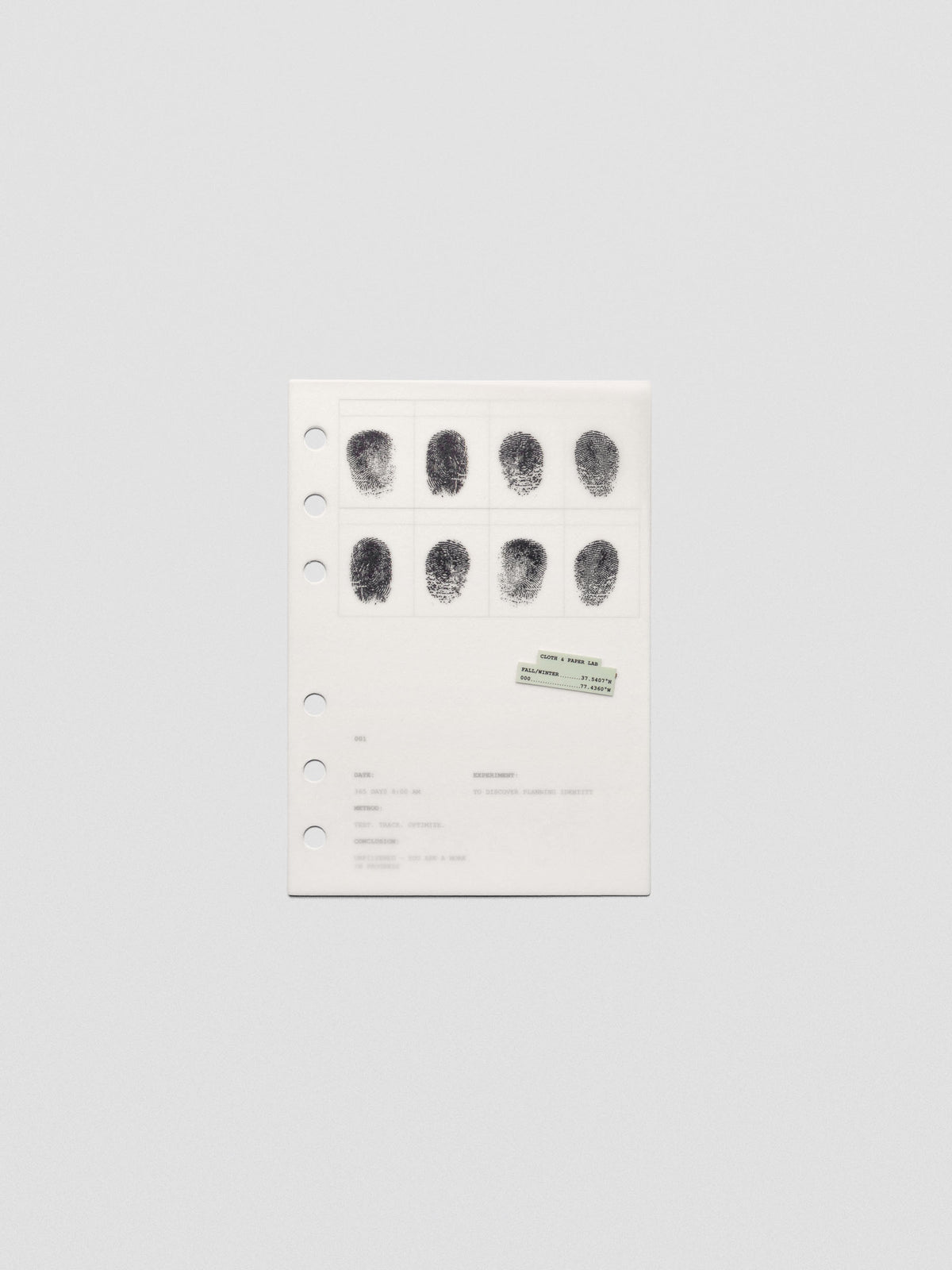 Two layered A6 sized planner dashboards, one semi-transparent, one matte, featuring a fingerprint design.