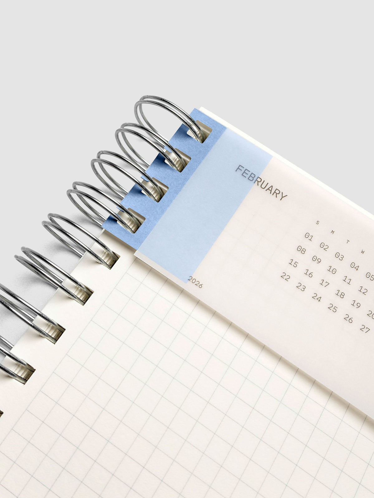 System Punch Stickers in Hyacinth, holding a page in a spiral notebook