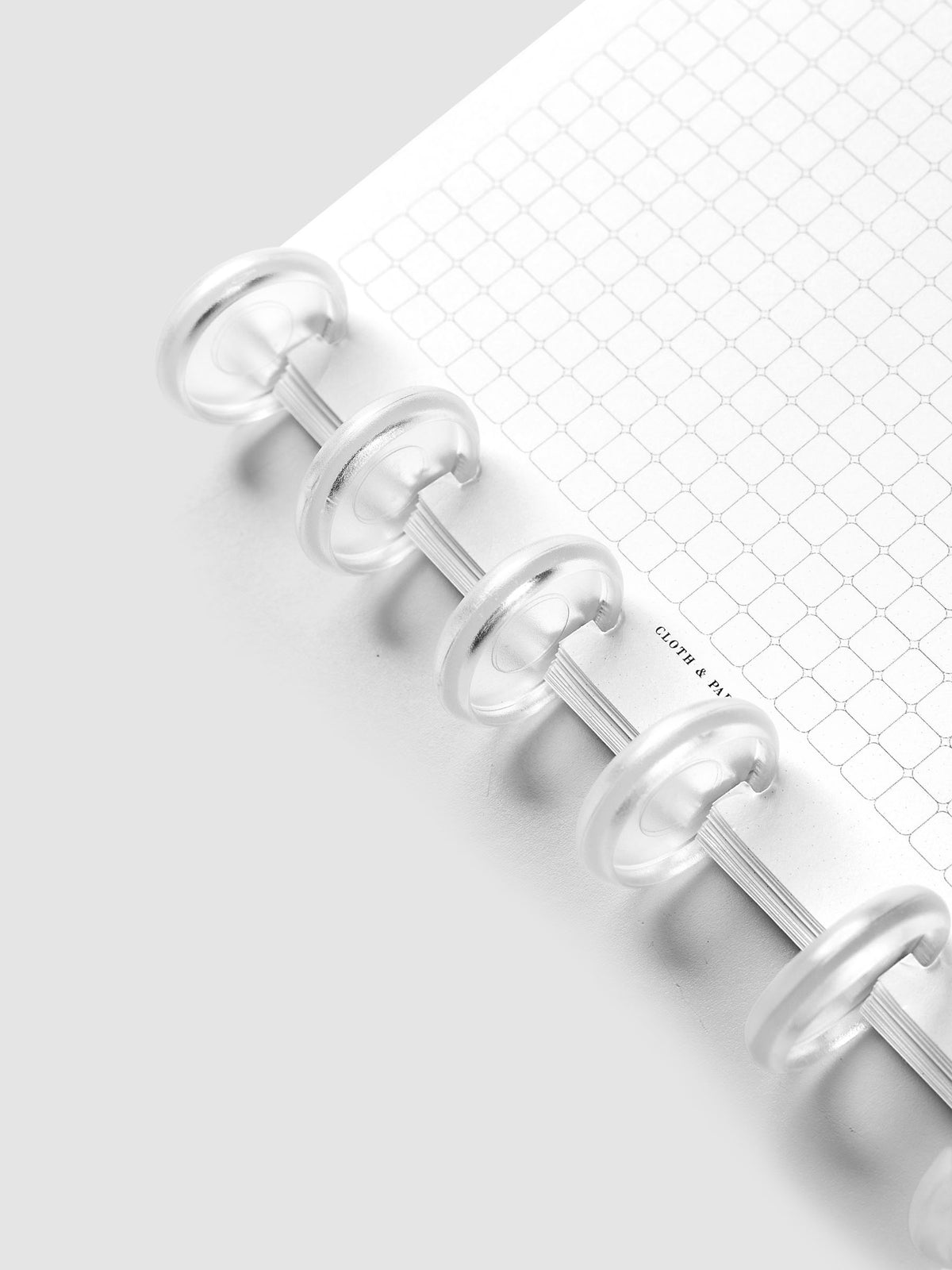 1 inch clear, transparent planner discs shown in use with planner inserts.