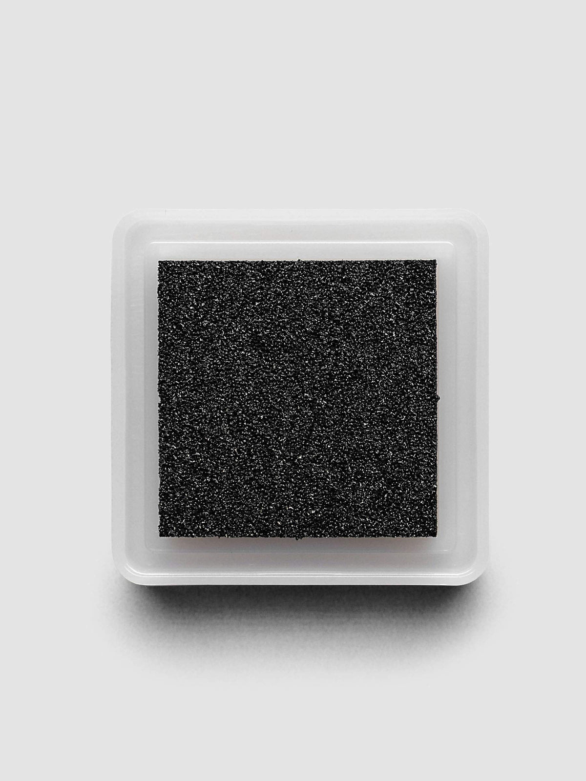 Artnic Stamp Ink Pad in charcoal seen from the side with cover on