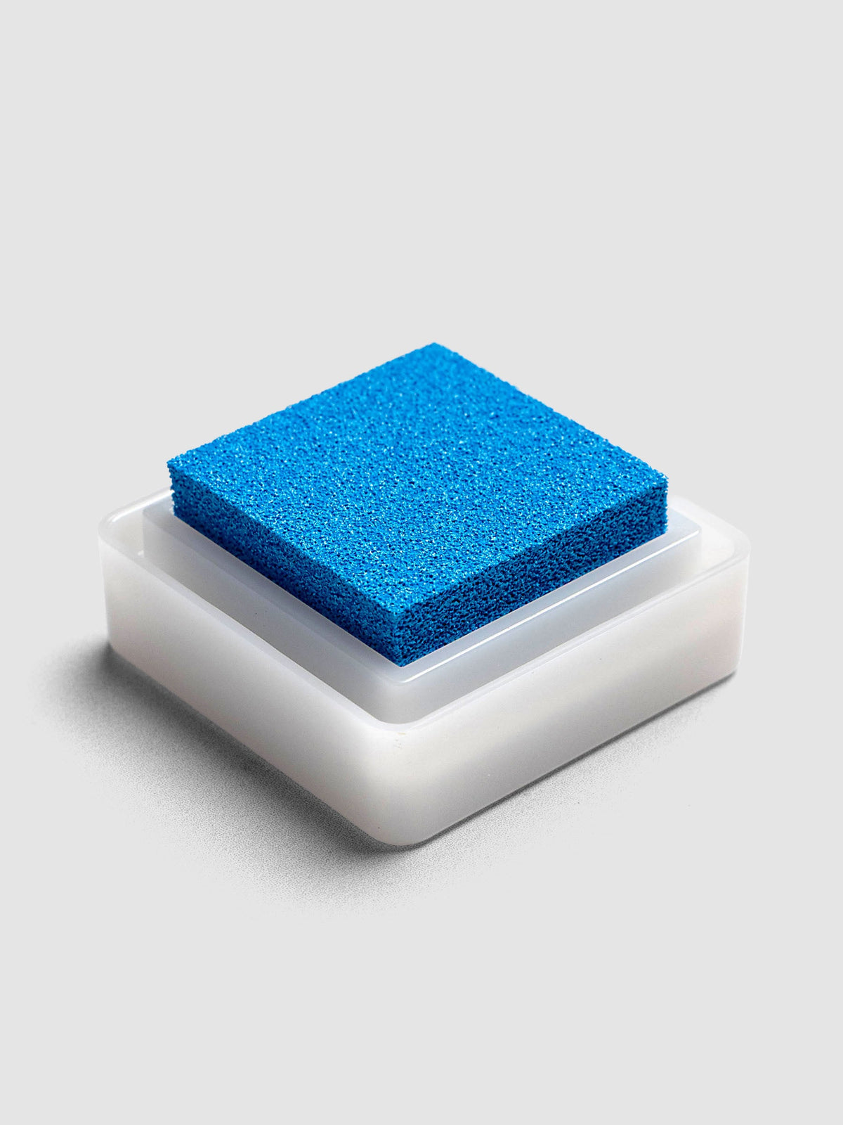 Artnic Stamp Ink Pad in cyan seen from the side with cover removed