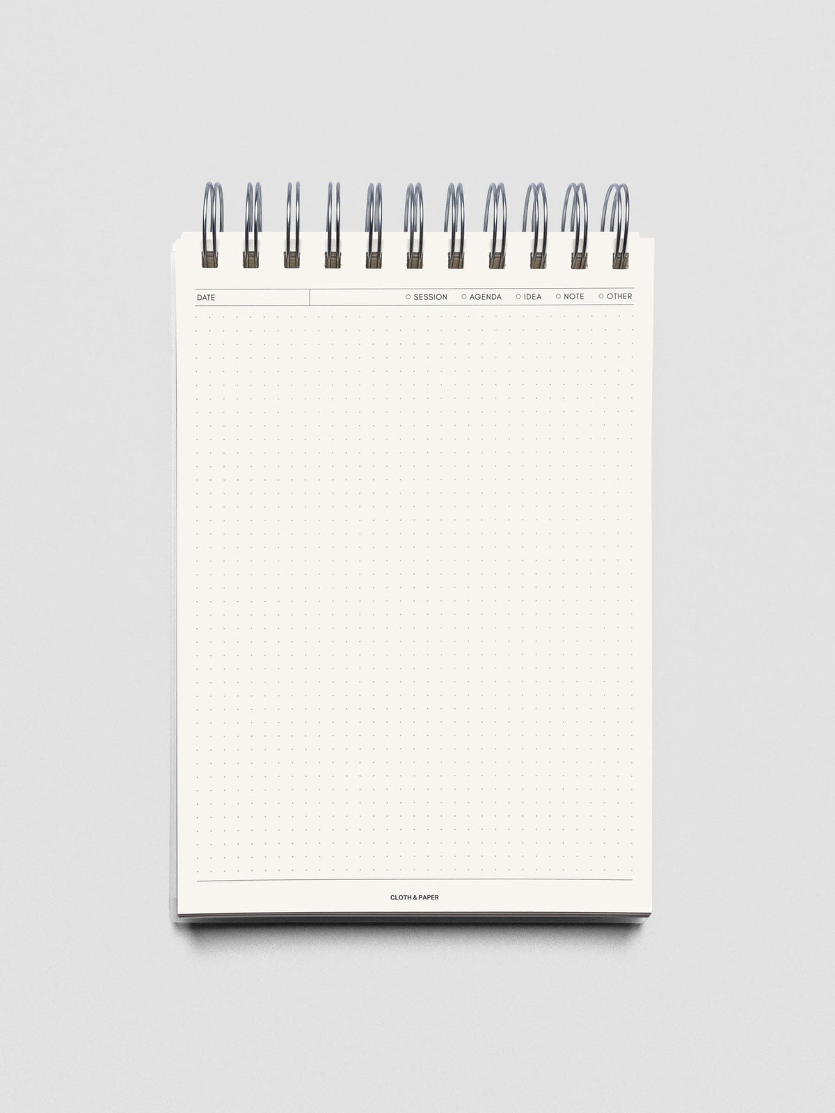 Break Room notebook shown open and folded over displaying an empty page.