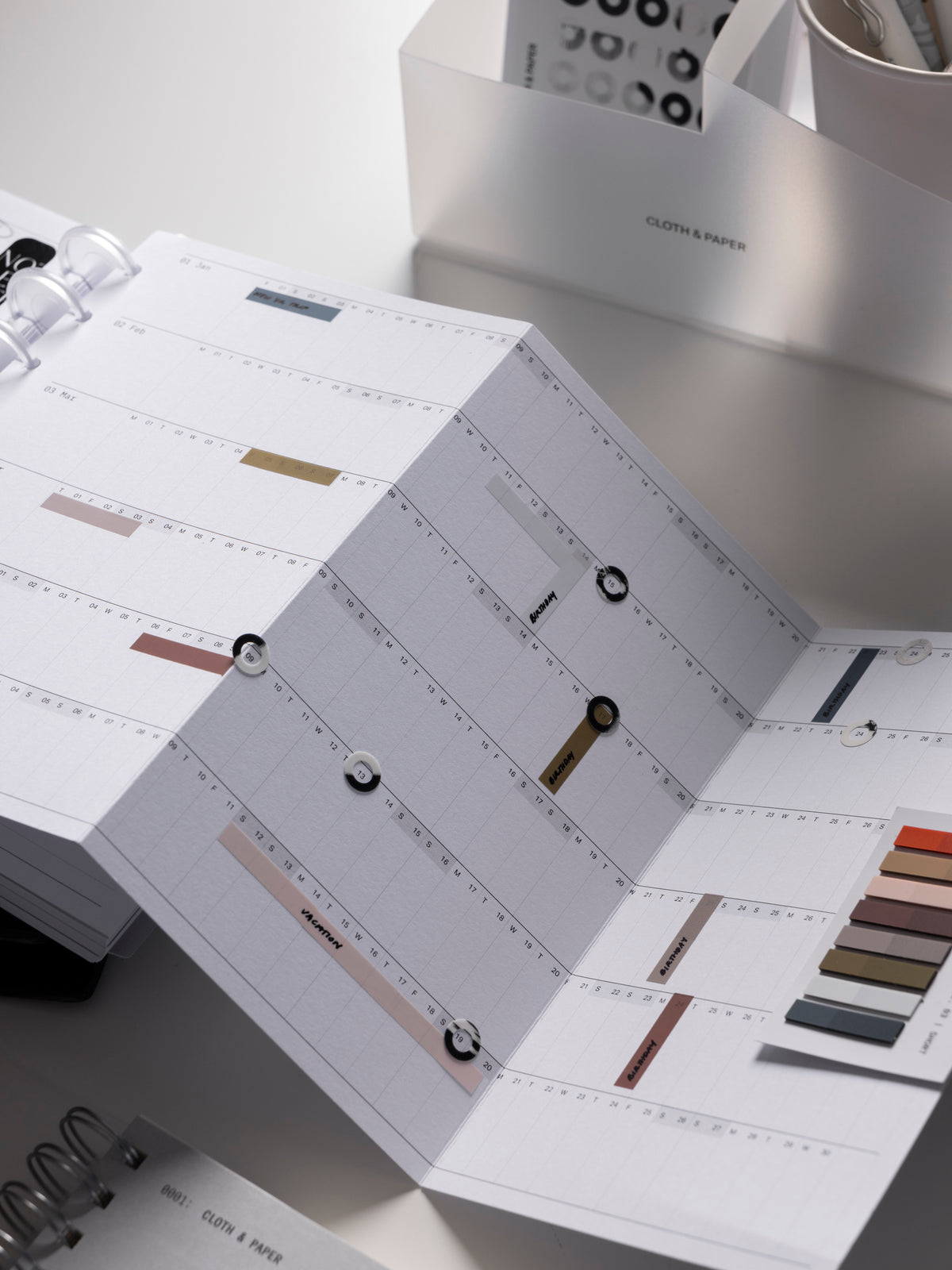 2027 Dated Fold Out Planner Insert shown in use with stickers and page flags