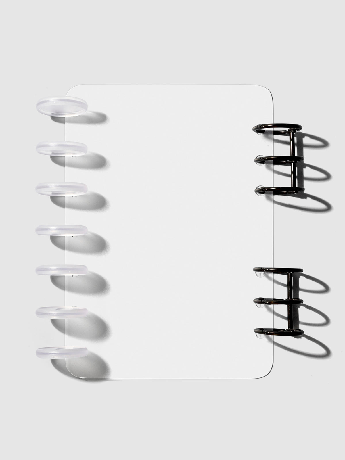 HP Mini / Personal cover displayed on a neutral background. It is shown filled with a set of clear planner discs and black planner rings.