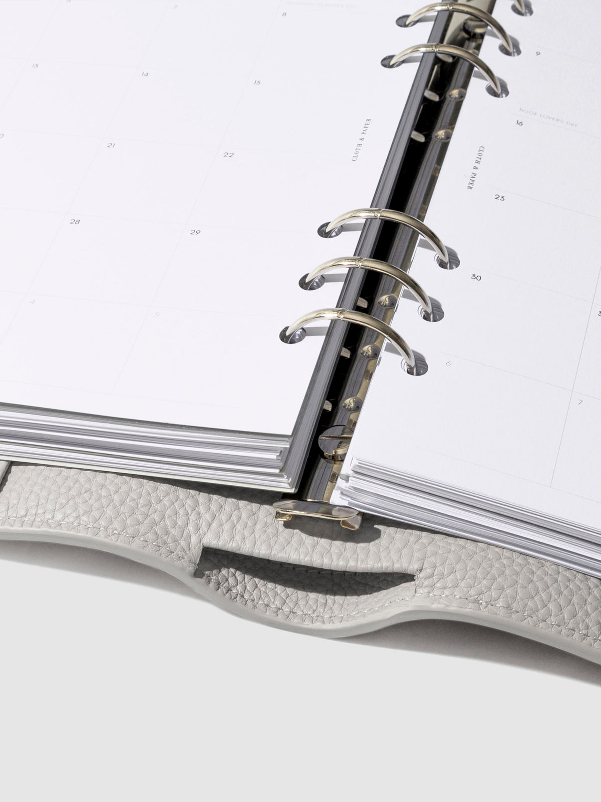 Close-up of the ash leather agenda ring mechanism.