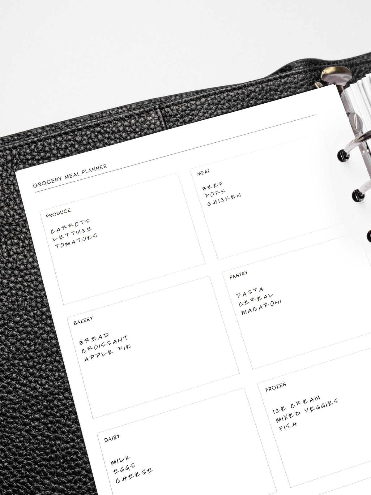 Closeup of a Grocery Meal Planner Insert inside a planner.
