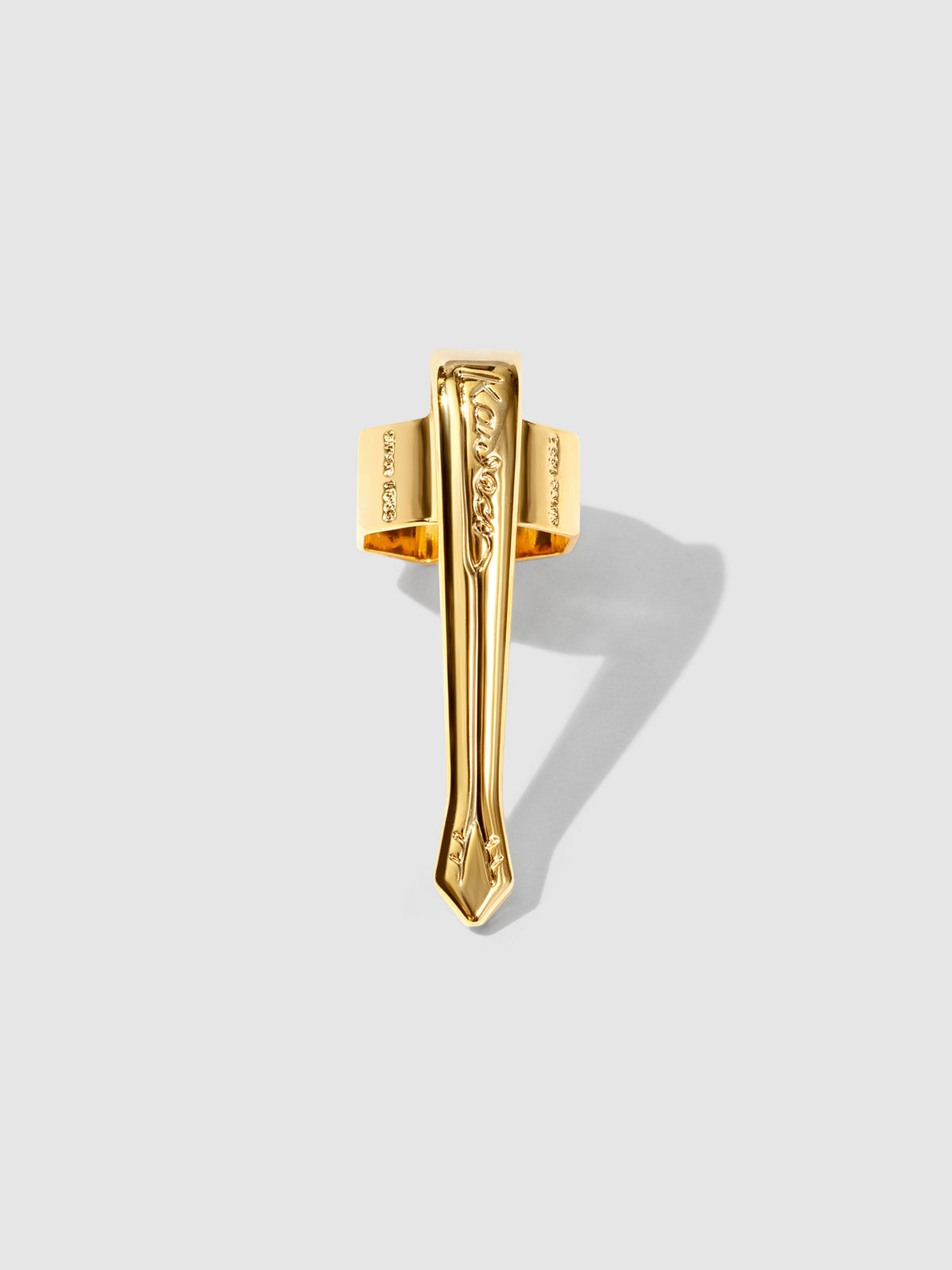 Nostalgic  gold clip displayed on a neutral background.