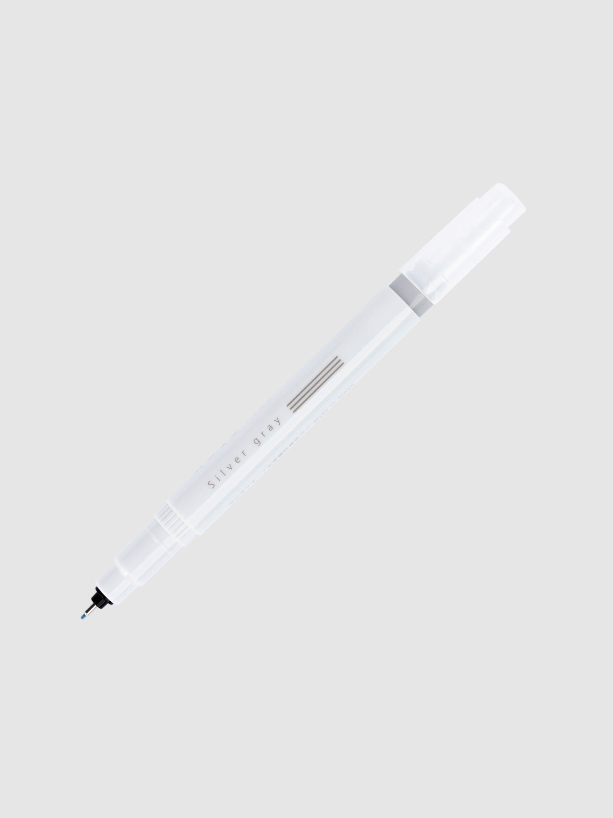 Fineliner marker in Silver Gray with nib exposed and cap posted to the end of its barrel on a neutral background.