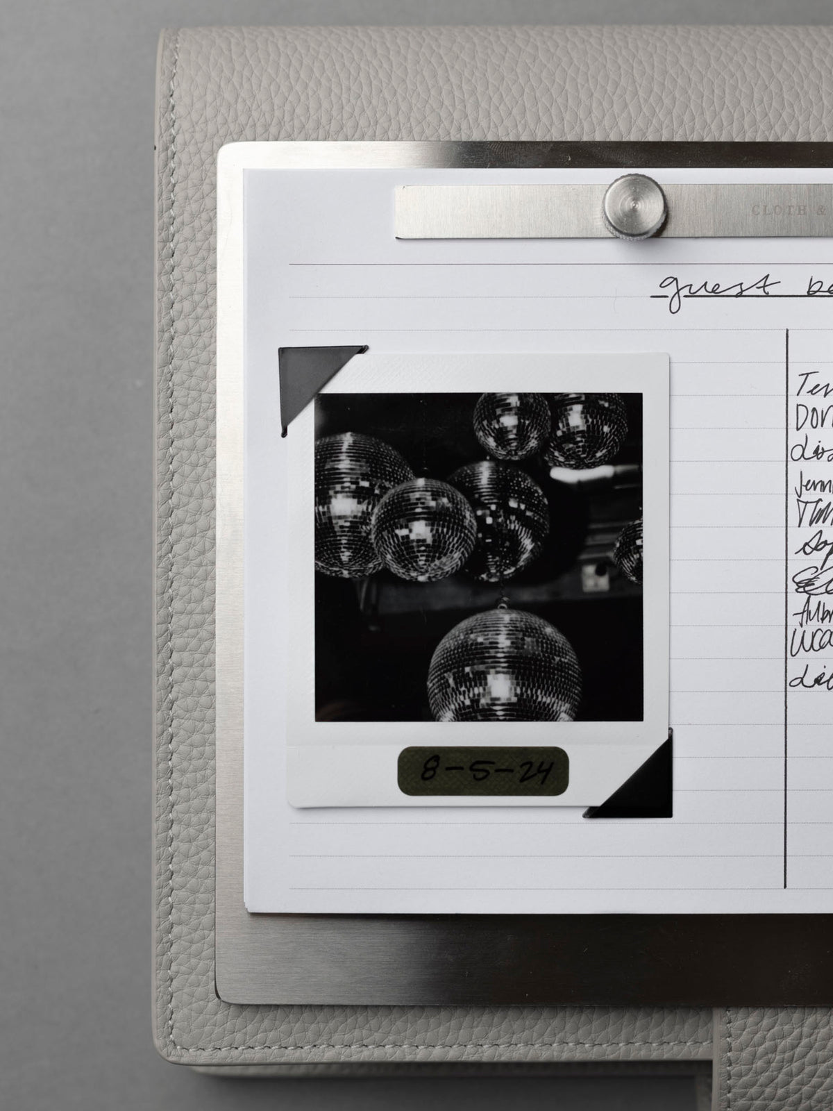 Modern Bound Notepad board, which is stainless steel metal with inserts.